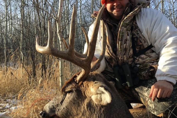 Geye and his 5×5 buck at Elusive Saskatchewan Whitetail Outfitters